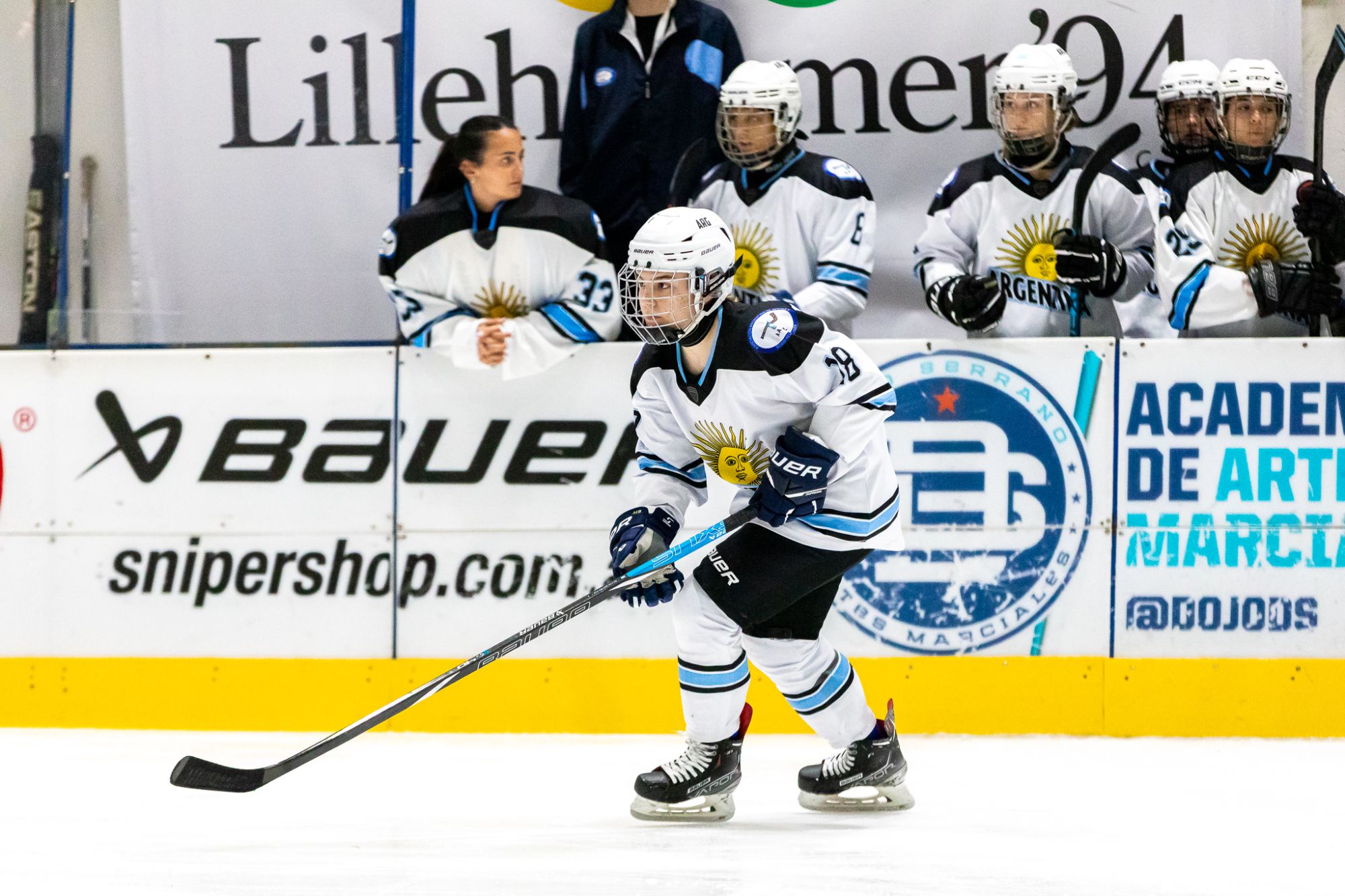 Argentina women's player with Bauer stick under stadium lights